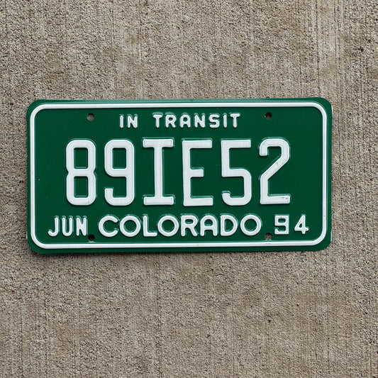 Photo of a 1994 Colorado In Transit Dealer License Plate Auto Tag Garage Decor Vintage 89 IE 52 with original patina