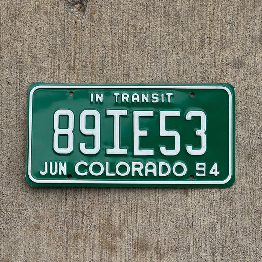 Photo of a 1994 Colorado In Transit Dealer License Plate Auto Tag Garage Decor Vintage 89 IE 53 with original patina