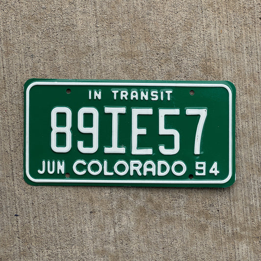 Photo of a 1994 Colorado In Transit Dealer License Plate Auto Tag Garage Decor Vintage 89 IE 57 with original patina
