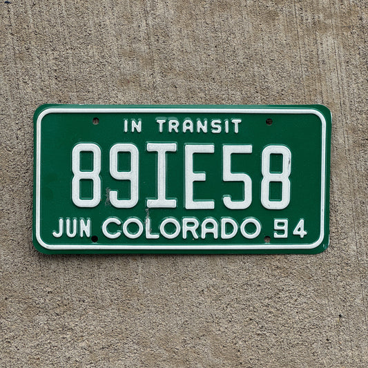 Photo of a 1994 Colorado In Transit Dealer License Plate Auto Tag Garage Decor Vintage 89 IE 58 with original patina