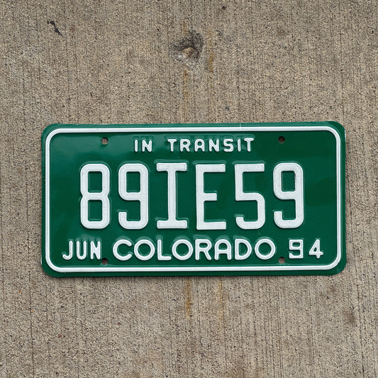 Photo of a 1994 Colorado In Transit Dealer License Plate Auto Tag Garage Decor Vintage 89 IE 59 with original patina
