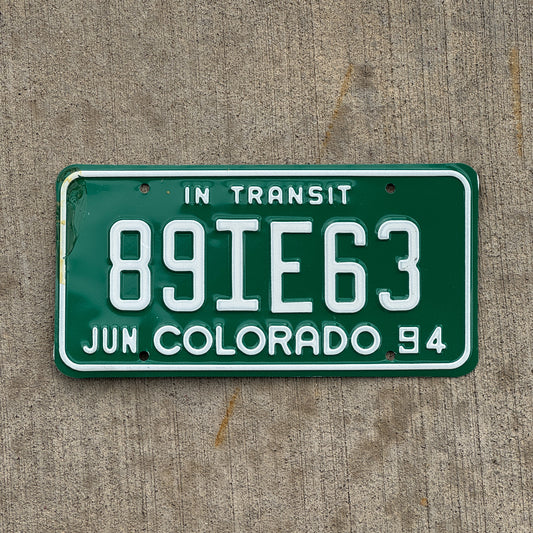 Photo of a 1994 Colorado In Transit Dealer License Plate Auto Tag Garage Decor Vintage 89 IE 63 with original patina