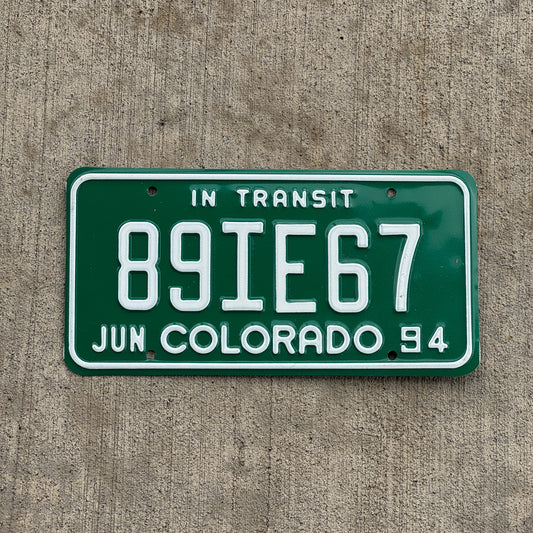 Photo of a 1994 Colorado In Transit Dealer License Plate Auto Tag Garage Decor Vintage 89 IE 67 with original patina