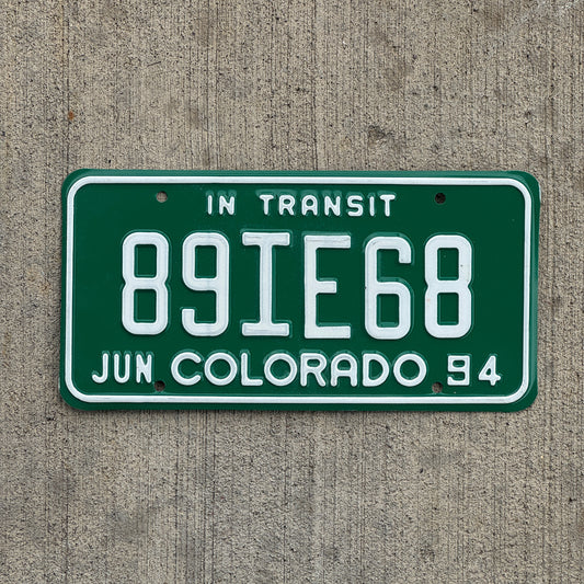Photo of a 1994 Colorado In Transit Dealer License Plate Auto Tag Garage Decor Vintage 89 IE 68 with original patina