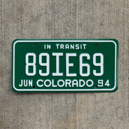 Photo of a 1994 Colorado In Transit Dealer License Plate Auto Tag Garage Decor Vintage 89 IE 69 with original patina