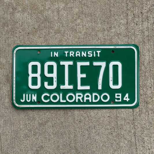 Photo of a 1994 Colorado In Transit Dealer License Plate Auto Tag Garage Decor Vintage 89 IE 70 with original patina
