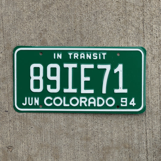 Photo of a 1994 Colorado In Transit Dealer License Plate Auto Tag Garage Decor Vintage 89 IE 71 with original patina