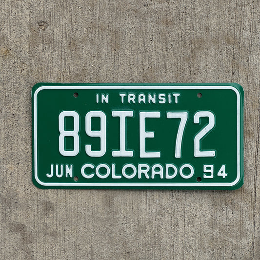 Photo of a 1994 Colorado In Transit Dealer License Plate Auto Tag Garage Decor Vintage 89 IE 72 with original patina