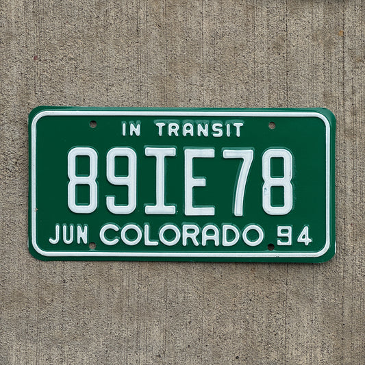 Photo of a 1994 Colorado In Transit Dealer License Plate Auto Tag Garage Decor Vintage 89 IE 78 with original patina