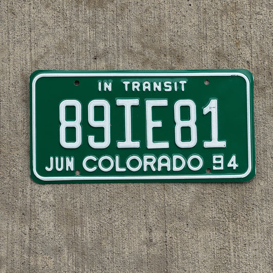 Photo of a 1994 Colorado In Transit Dealer License Plate Auto Tag Garage Decor Vintage 89 IE 81 with original patina