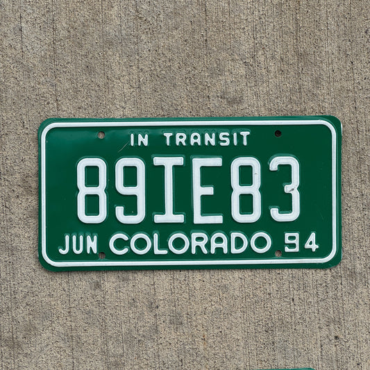 Photo of a 1994 Colorado In Transit Dealer License Plate Auto Tag Garage Decor Vintage 89 IE 83 with original patina