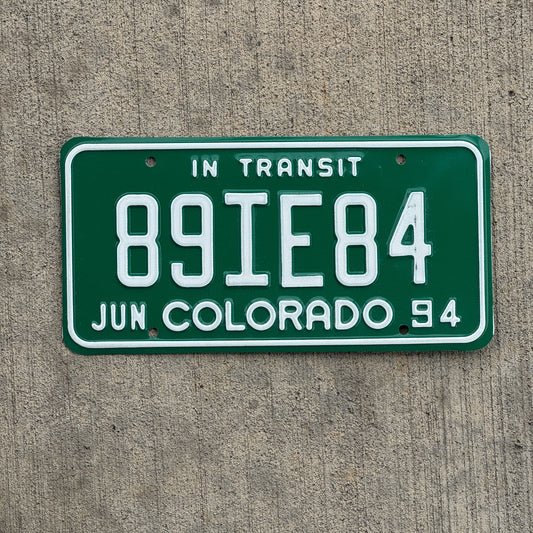 Photo of a 1994 Colorado In Transit Dealer License Plate Auto Tag Garage Decor Vintage 89 IE 84 with original patina