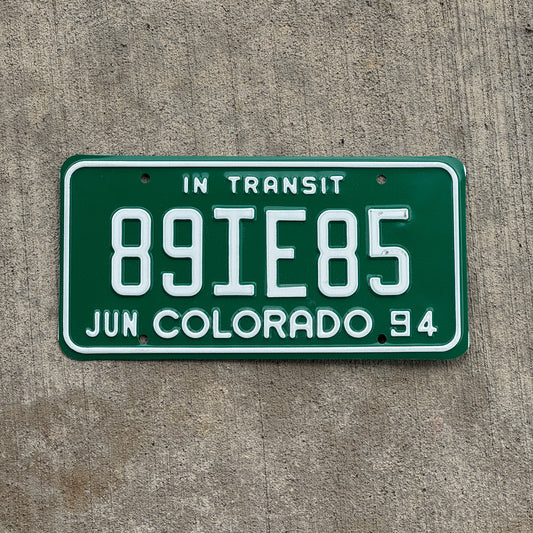 Photo of a 1994 Colorado In Transit Dealer License Plate Auto Tag Garage Decor Vintage 89 IE 85 with original patina
