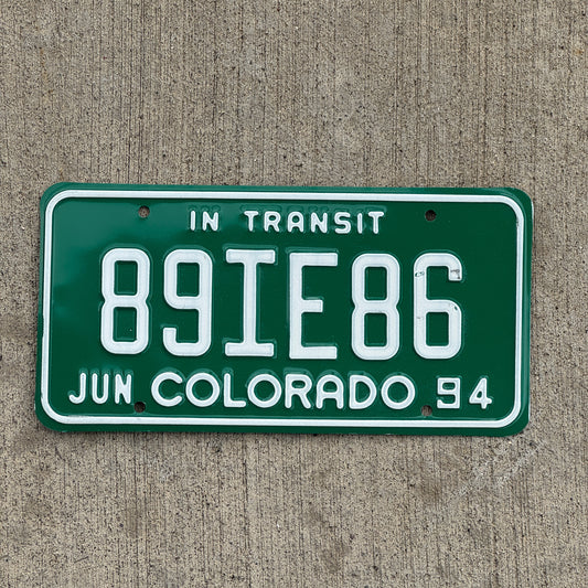 Photo of a 1994 Colorado In Transit Dealer License Plate Auto Tag Garage Decor Vintage 89 IE 86 with original patina