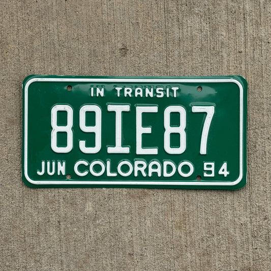 Photo of a 1994 Colorado In Transit Dealer License Plate Auto Tag Garage Decor Vintage 89 IE 87 with original patina