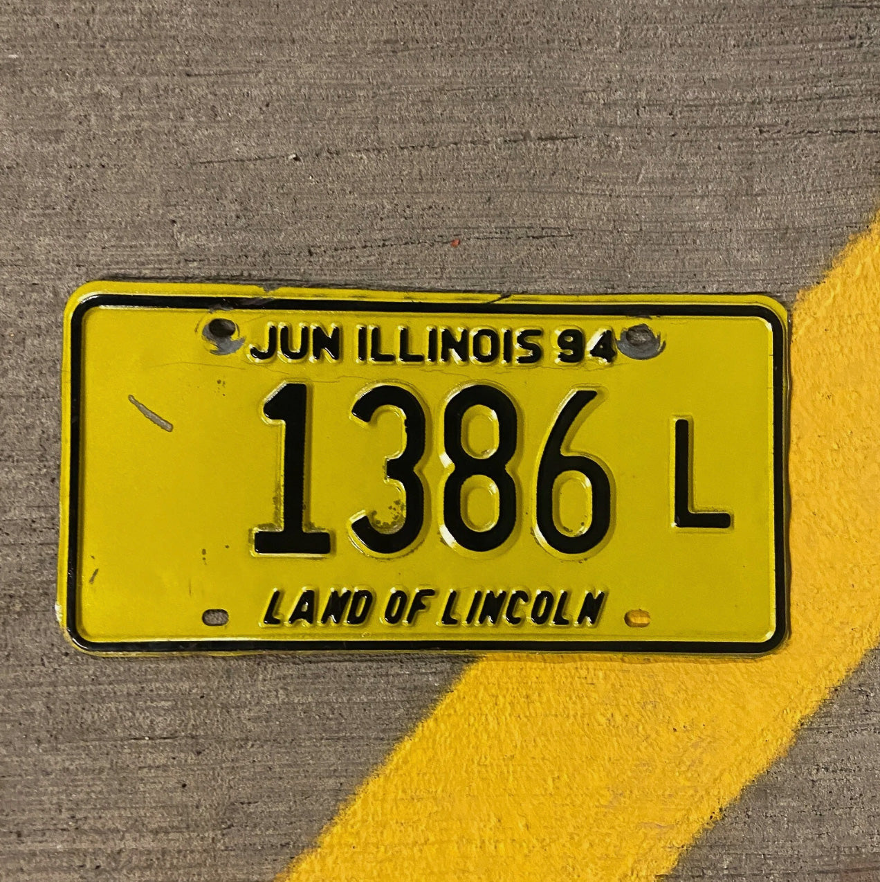 Photo of a 1994 Illinois Truck License Plate Auto Tag Garage Decor Vintage 1386 L with original patina