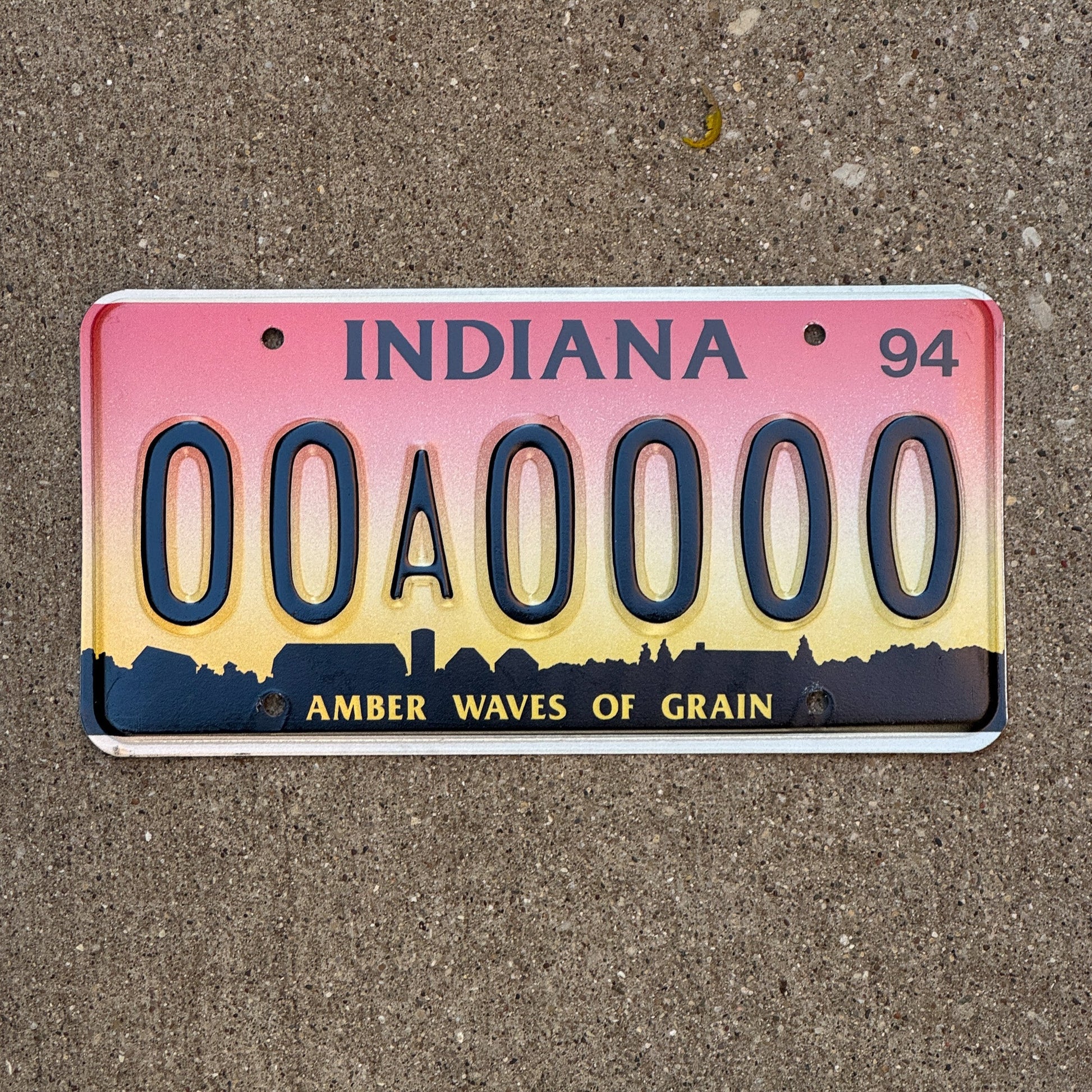 Photo of a 1994 Indiana Sample License Plate Auto Tag 3 Vintage 00A0000 with original patina