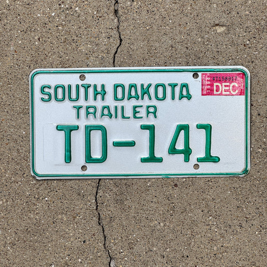 Photo of a 1994 South Dakota Trailer License Plate Auto Tag Garage Decor Vintage TD 141