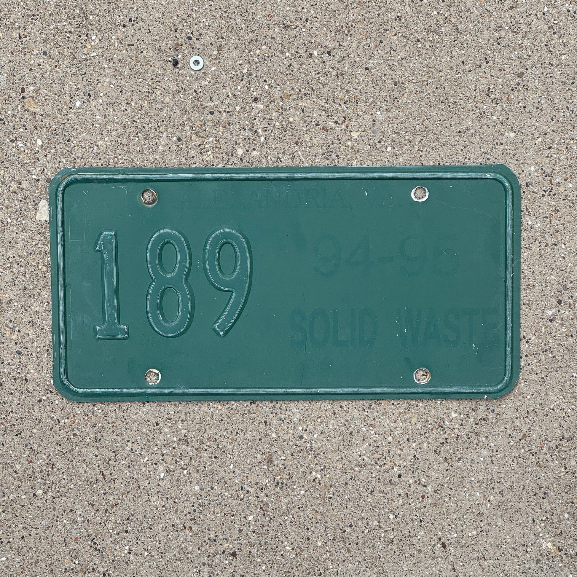 Photo of a 1994 Virginia Solid Waste License Plate Auto Tag Garage Decor Vintage 189