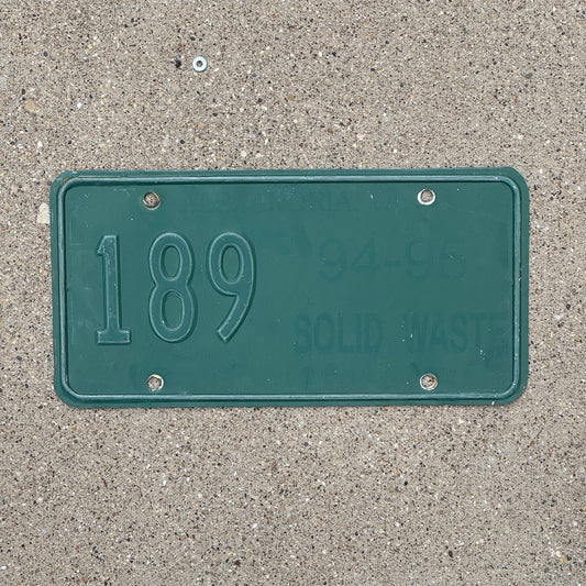 Photo of a 1994 Virginia Solid Waste License Plate Auto Tag Garage Decor Vintage 189