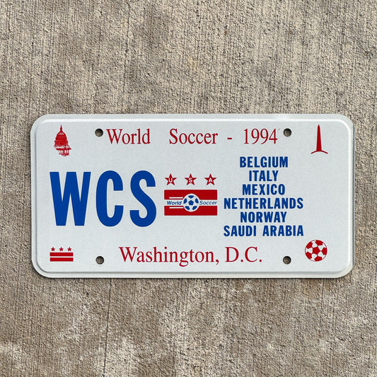 Photo of a 1994 Washington DC Prototype License Plate Auto Tag Garage Decor Vintage Flat Version World Cup Soccer WCS with original patina