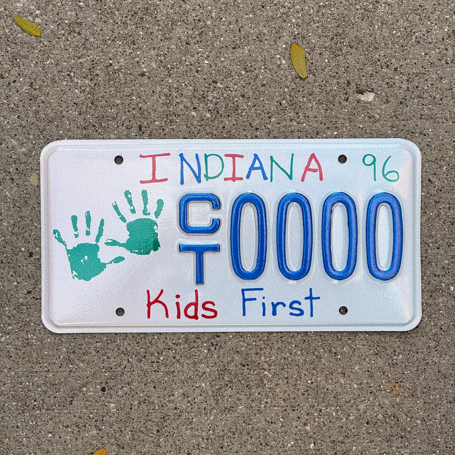 Photo of a 1995 1996 Indiana Graphic Sample License Plate Auto Tag Garage Decor Vintage Kids Children's Trust CT 0000 with original patina