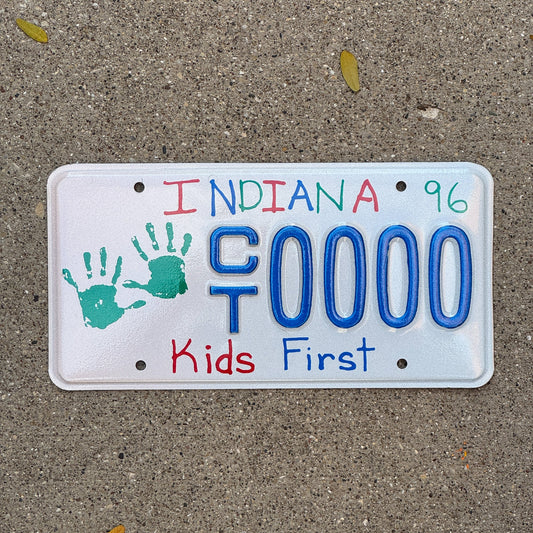 Photo of a 1995 1996 Indiana Graphic Sample License Plate Auto Tag Garage Decor Vintage Kids Children's Trust CT 0000 with original patina