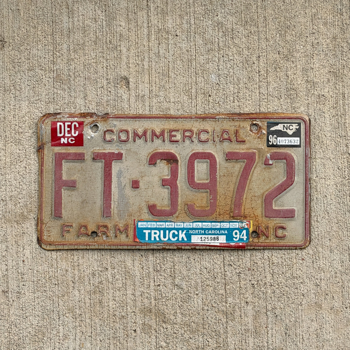 Photo of a 1995 1996 North Carolina Farm Truck License Plate Auto Tag Garage Decor Vintage FT 3972 with original patina