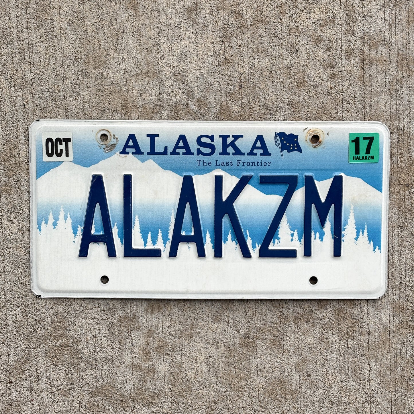 Photo of a 1995 2017 Alaska Vanity License Plate Auto Tag Garage Decor Vintage Alakazam Magic Spell Incantation ALAKZM with original patina