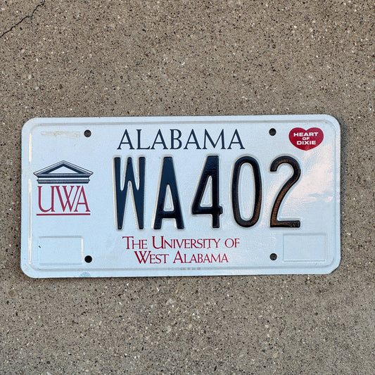 Photo of a 1995 Alabama Graphic / Specialty License Plate Auto Tag Garage Decor Vintage University of West Alabama WA 402 with original patina
