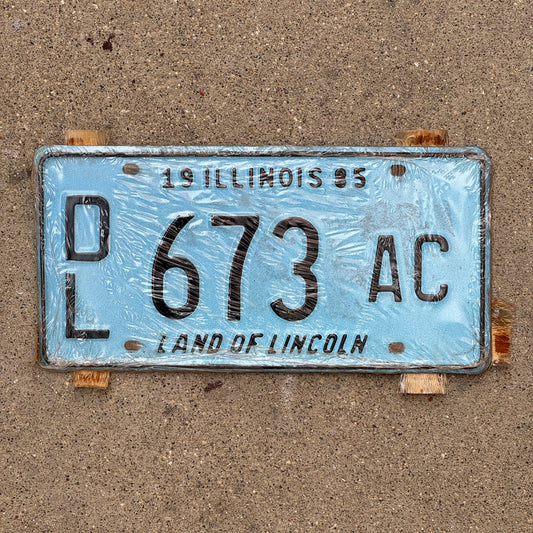 Photo of a 1995 Illinois Dealer License Plate Pair Auto Tag Garage Decor Vintage Merritt's Sterling Ford Mercury Lincoln Dealer 673 AC with original patina