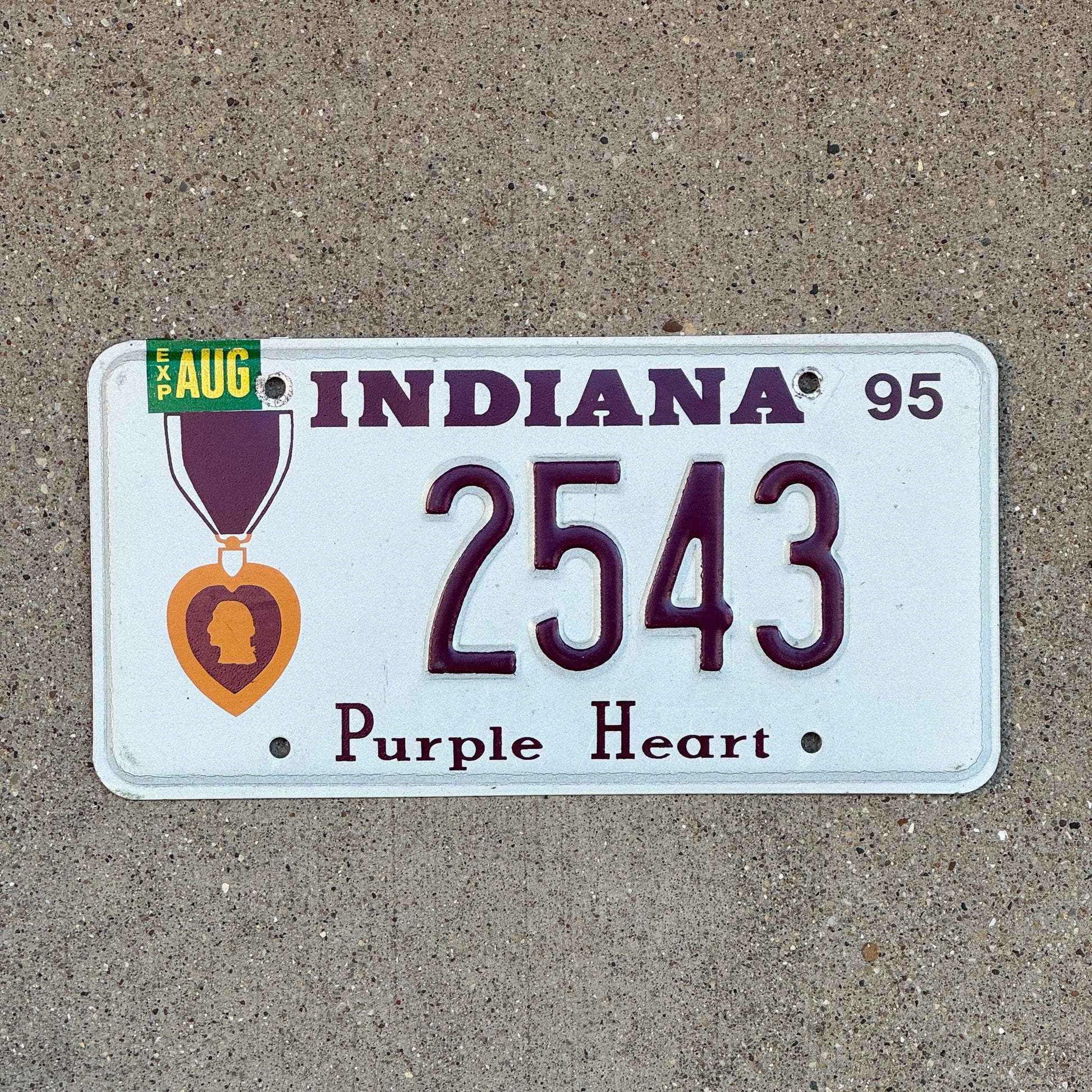 Photo of a 1995 Indiana Military License Plate Auto Tag Garage Decor Vintage Purple Heart 2543 with original patina