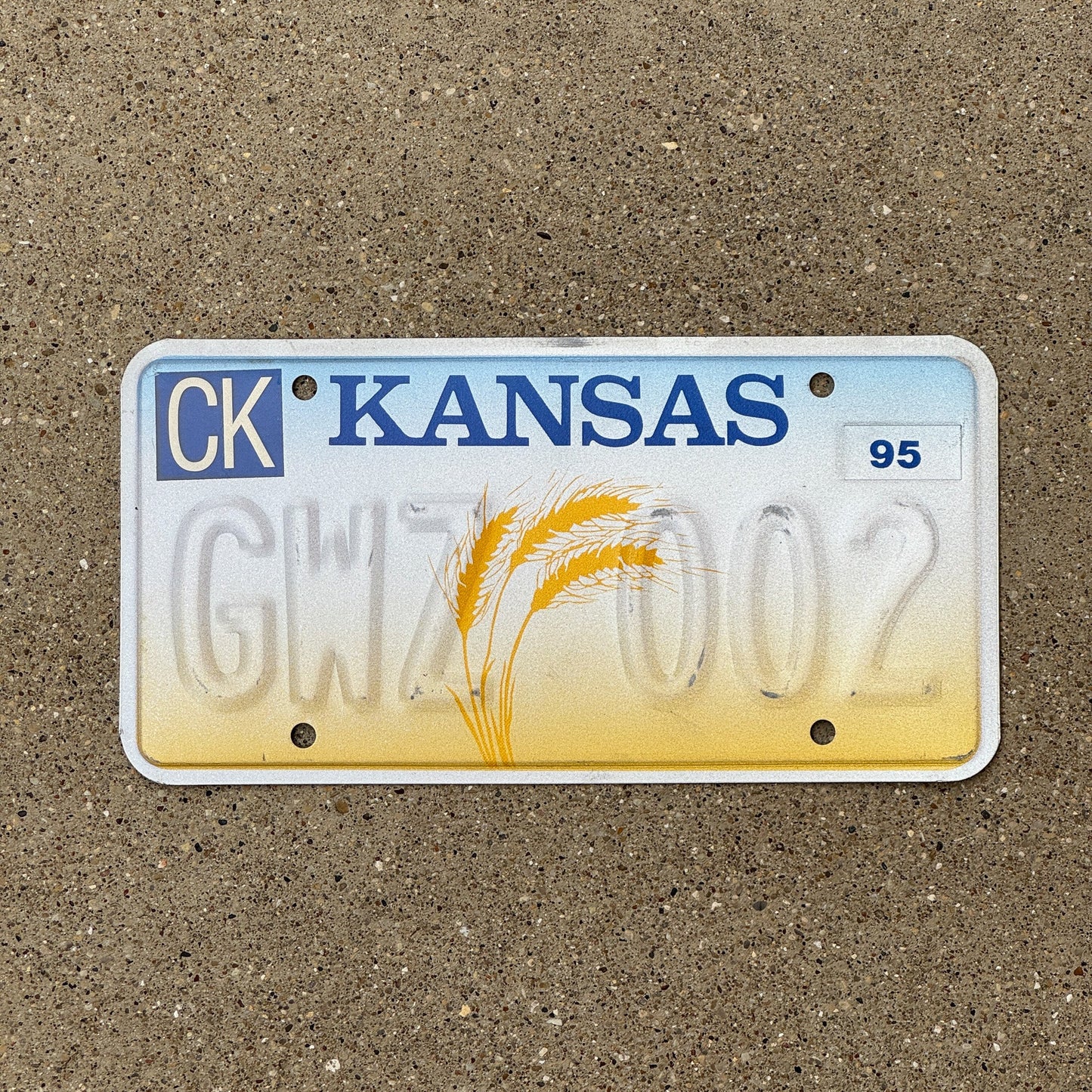 Photo of a 1995 Kansas Error License Plate Auto Tag Garage Decor Vintage Misprint GWZ 002
