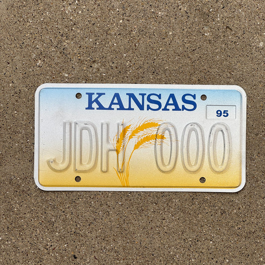 Photo of a 1995 Kansas Error License Plate Auto Tag Garage Decor Vintage Repeat Repeating Misprint JDH 000