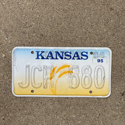 Photo of a 1995 Kansas Error License Plate Auto Tag Garage Decor Vintage Restamp Misprint JCP 880