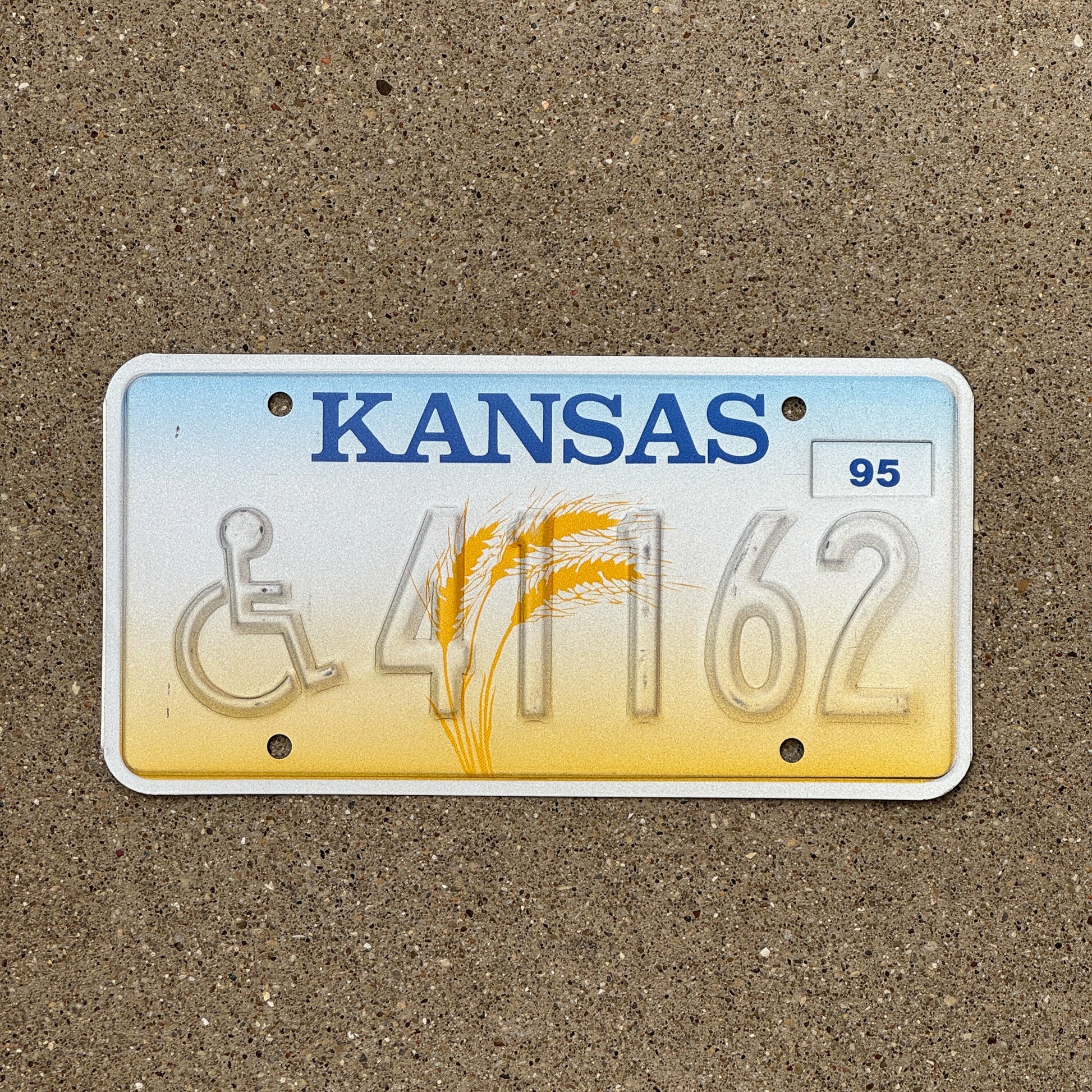 Photo of a 1995 Kansas Handicapped Error License Plate Auto Tag Garage Decor Vintage Misprint 41162