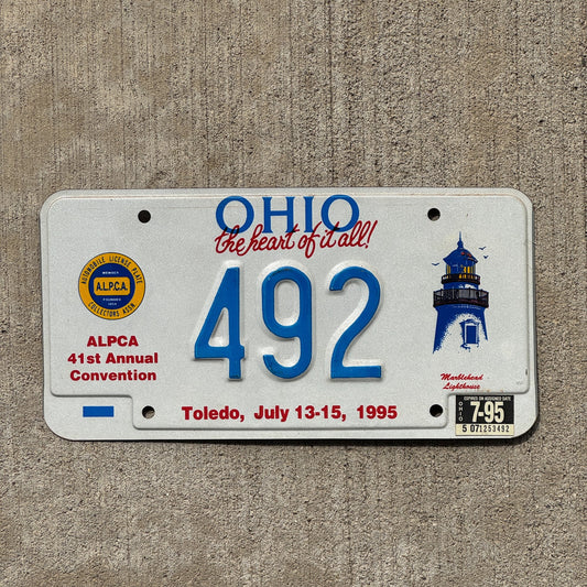 Photo of a 1995 Ohio License Plate Auto Tag Garage Decor Vintage Toledo ALPCA Convention 492