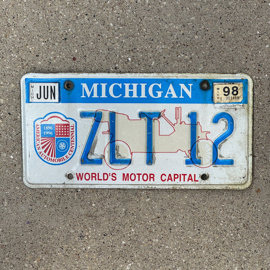 Photo of a 1996 1998 Michigan Graphic / Specialty License Plate Auto Tag Garage Decor Vintage World's Motor Capital ZLT 12
