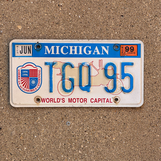 Photo of a 1996 1999 Michigan Graphic / Specialty License Plate Auto Tag Garage Decor Vintage World's Motor Capital TGQ 95