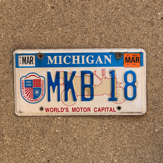 Photo of a 1996 2003 Michigan Graphic / Specialty License Plate Auto Tag Garage Decor Vintage World's Motor Capital MKB 18