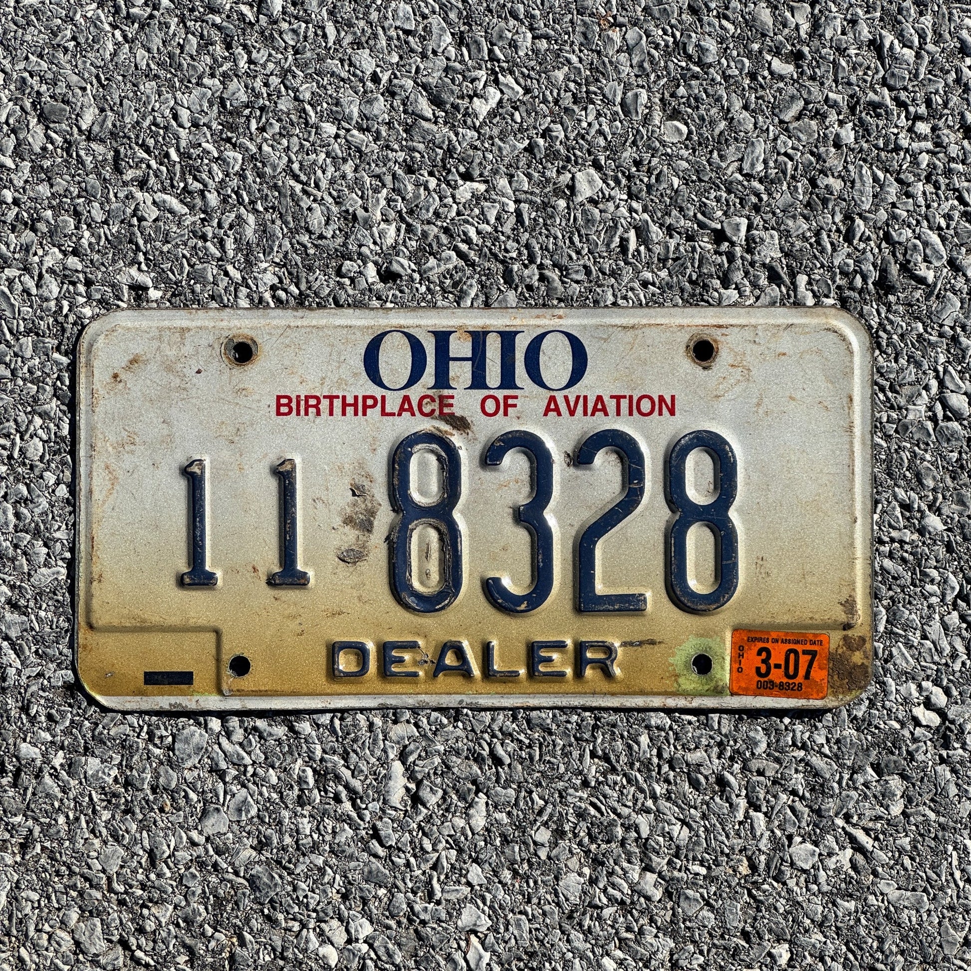 Photo of a 1996 2007 Ohio Dealer License Plate Auto Tag Garage Decor Vintage 11 8328
