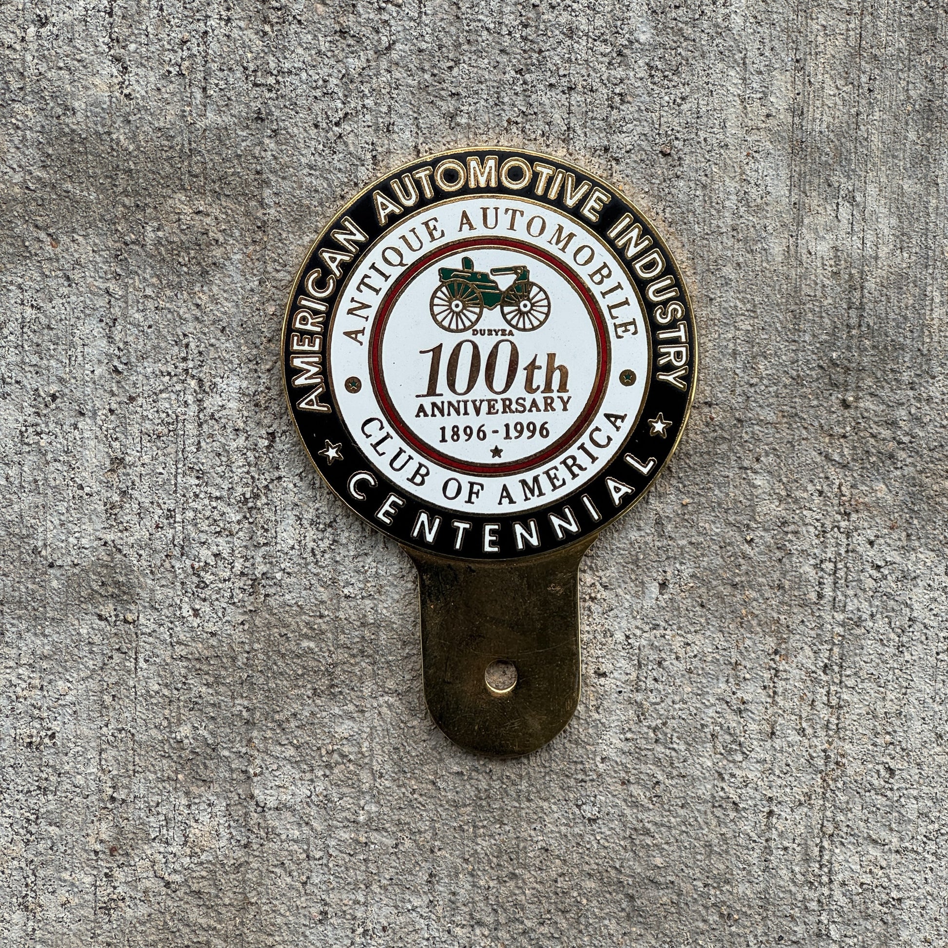Photo of a 1996 Antique Automobile Club of America Centennial License Plate Topper Auto Tag Garage Decor Vintage AACA with original patina