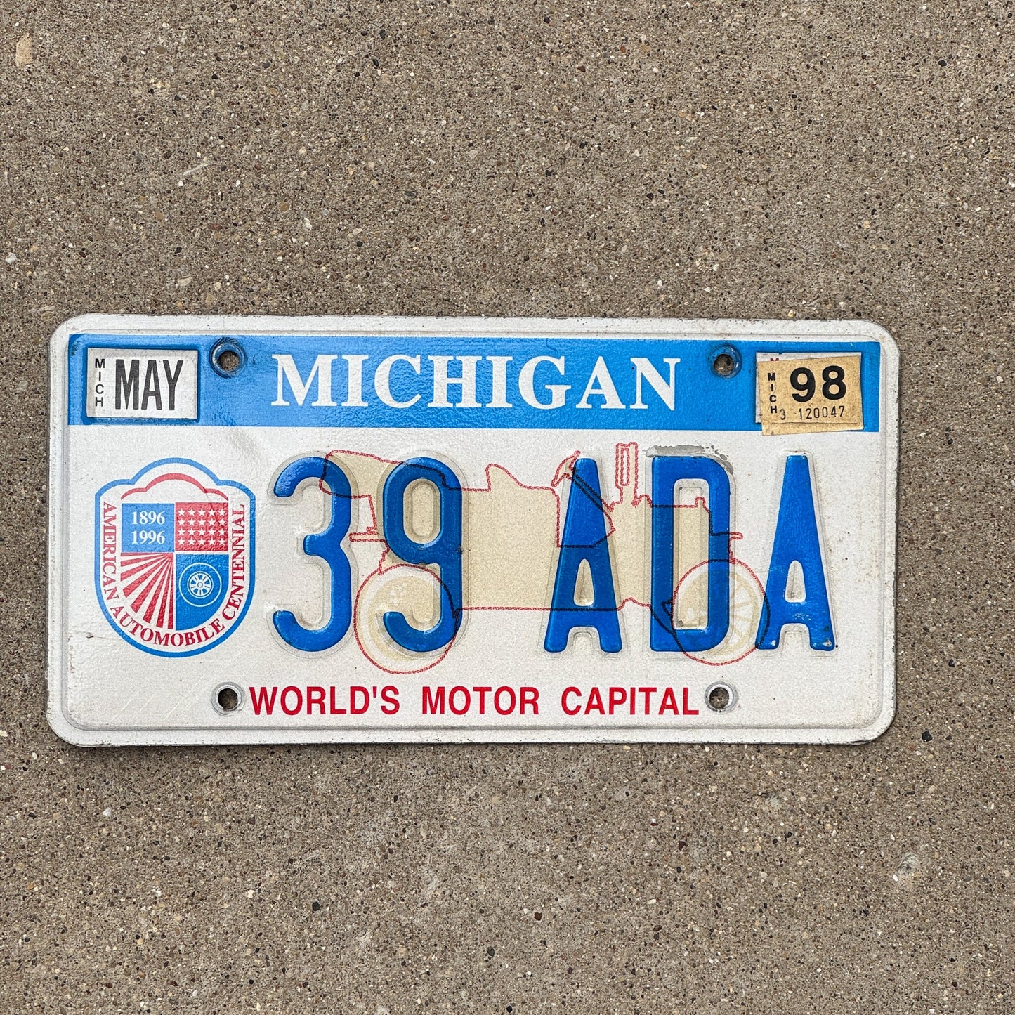 Photo of a 1996 Michigan Graphic / Specialty License Plate Auto Tag Garage Decor Vintage World's Motor Capital 39 ADA