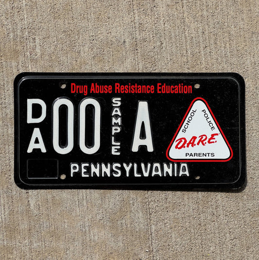 Photo of a 1996 Pennsylvania Graphic Sample License Plate Auto Tag Garage Decor Vintage Dare Drugs 00 A with original patina