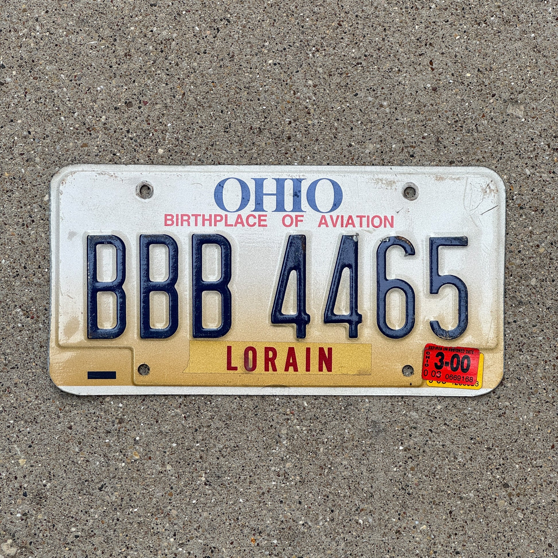 Photo of a 1997 2000 Ohio License Plate Auto Tag 1 Vintage Garage Repeat Repeating BBB 4465 with original patina