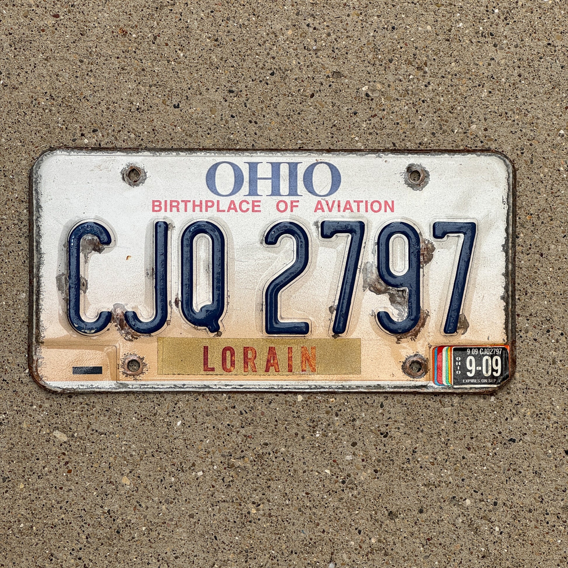 Photo of a 1997 2009 Ohio License Plate Auto Tag 1 Vintage Garage CJQ 2797 with original patina