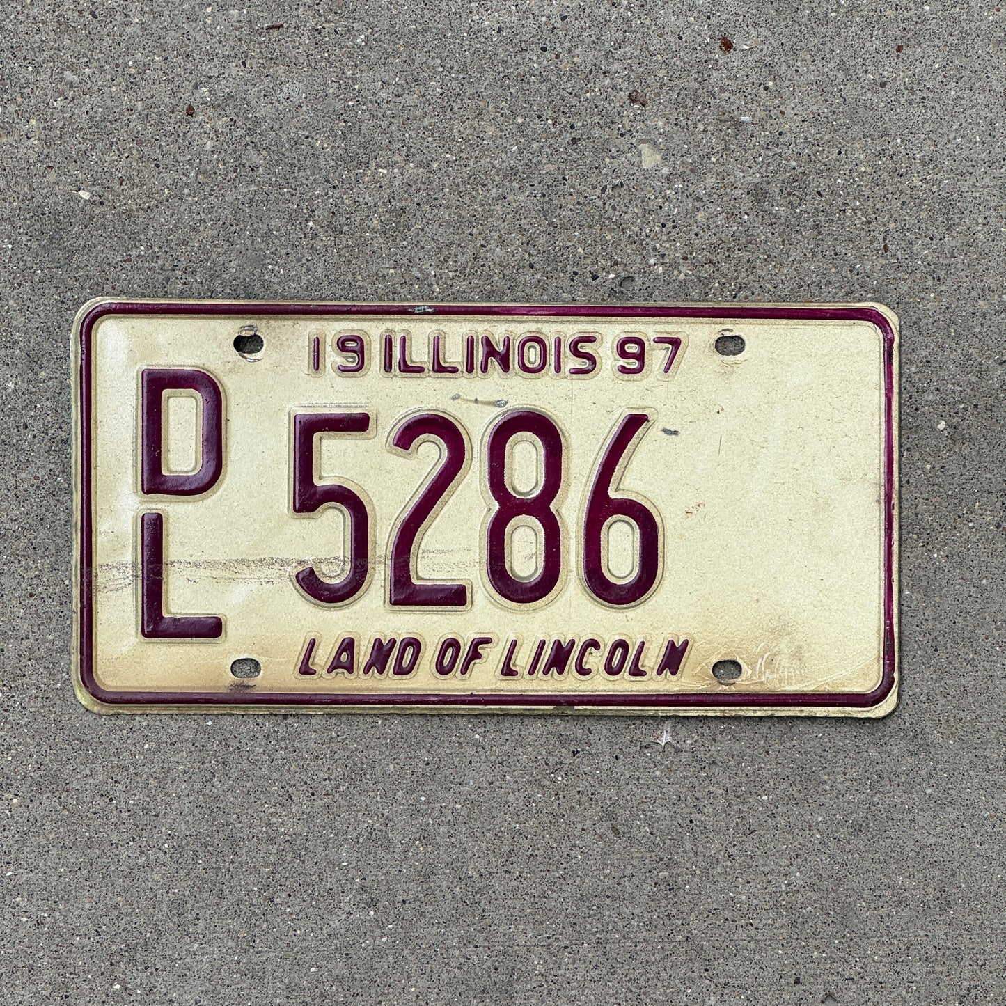 Photo of a 1997 Illinois Dealer License Plate Auto Tag 1 Vintage Garage 5286 with original patina
