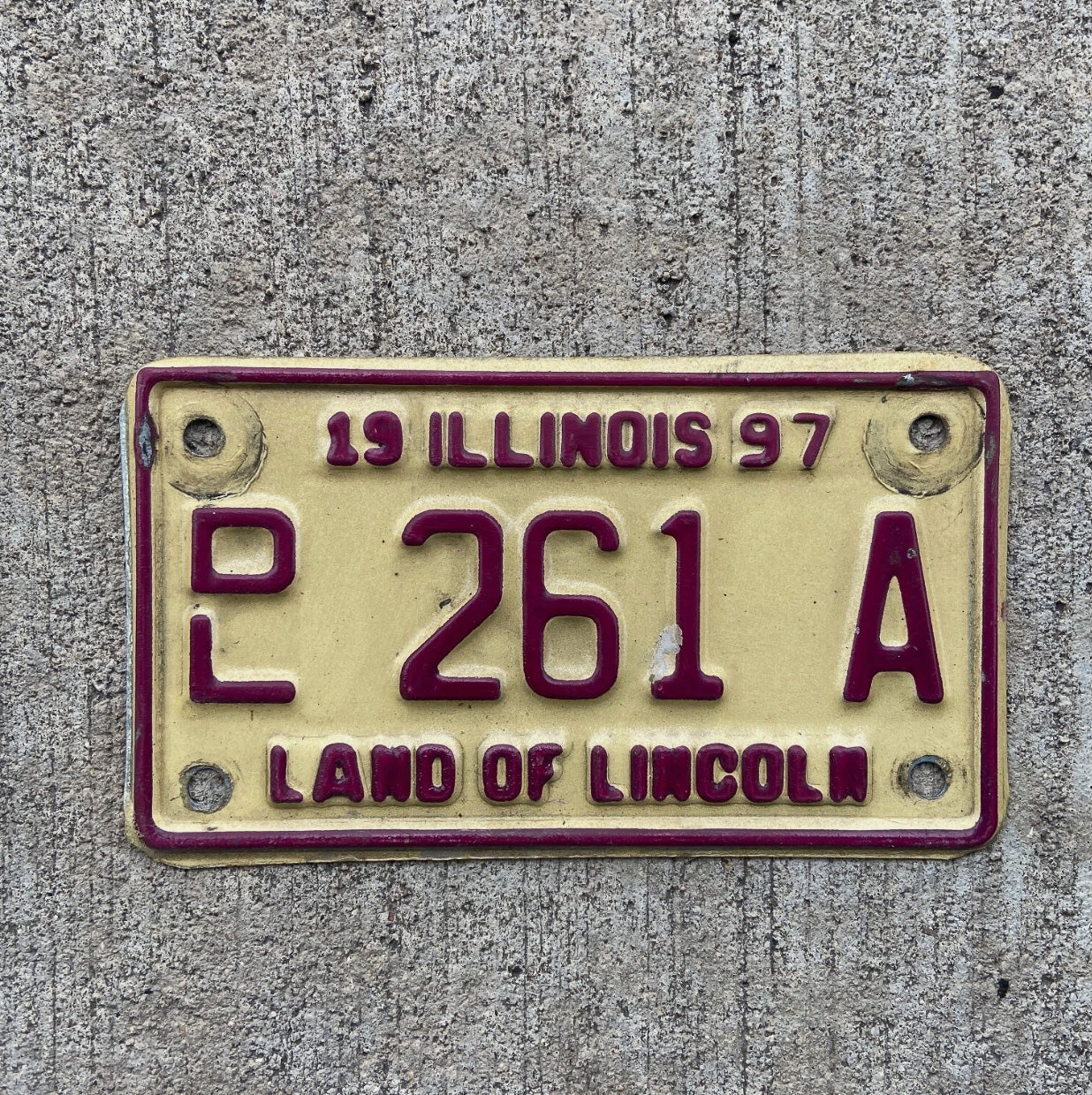 Photo of a 1997 Illinois Motorcycle Dealer License Plate Auto Tag Garage Decor Vintage 261 A with original patina