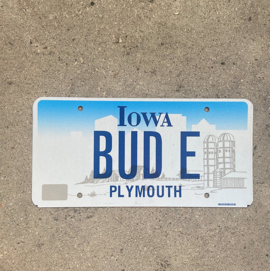 Photo of a 1997 Iowa Vanity License Plate Auto Tag Garage Decor Vintage Weed Smoke Buddy BUD E with original patina