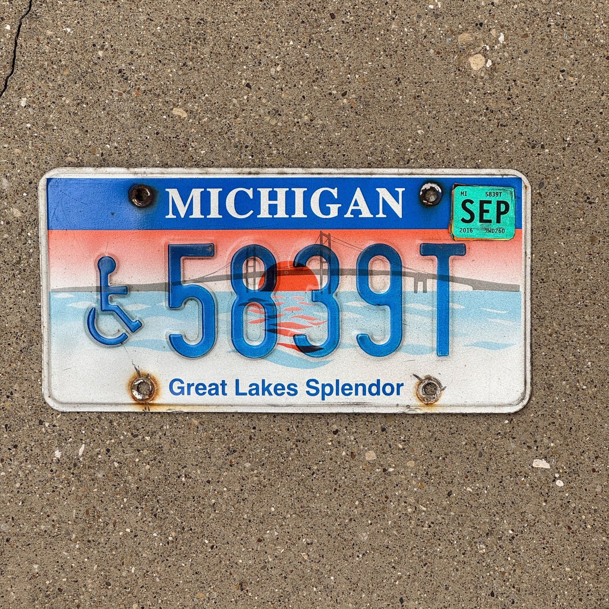 Photo of a 1997 Michigan Handicapped License Plate Auto Tag Garage Decor Vintage Graphic / Specialty Great Lakes Splendor 5839 T